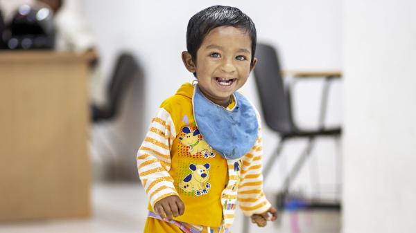 Image of a young child smiling